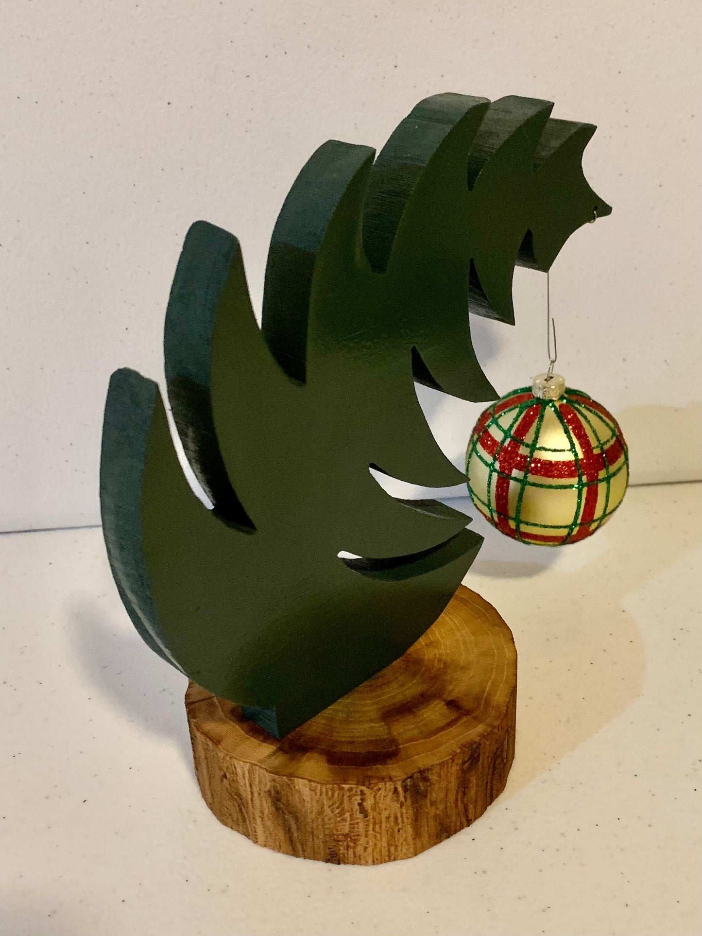 Small Leaning "Grinch Style" Christmas Tree With Natural Tree Trunk Base