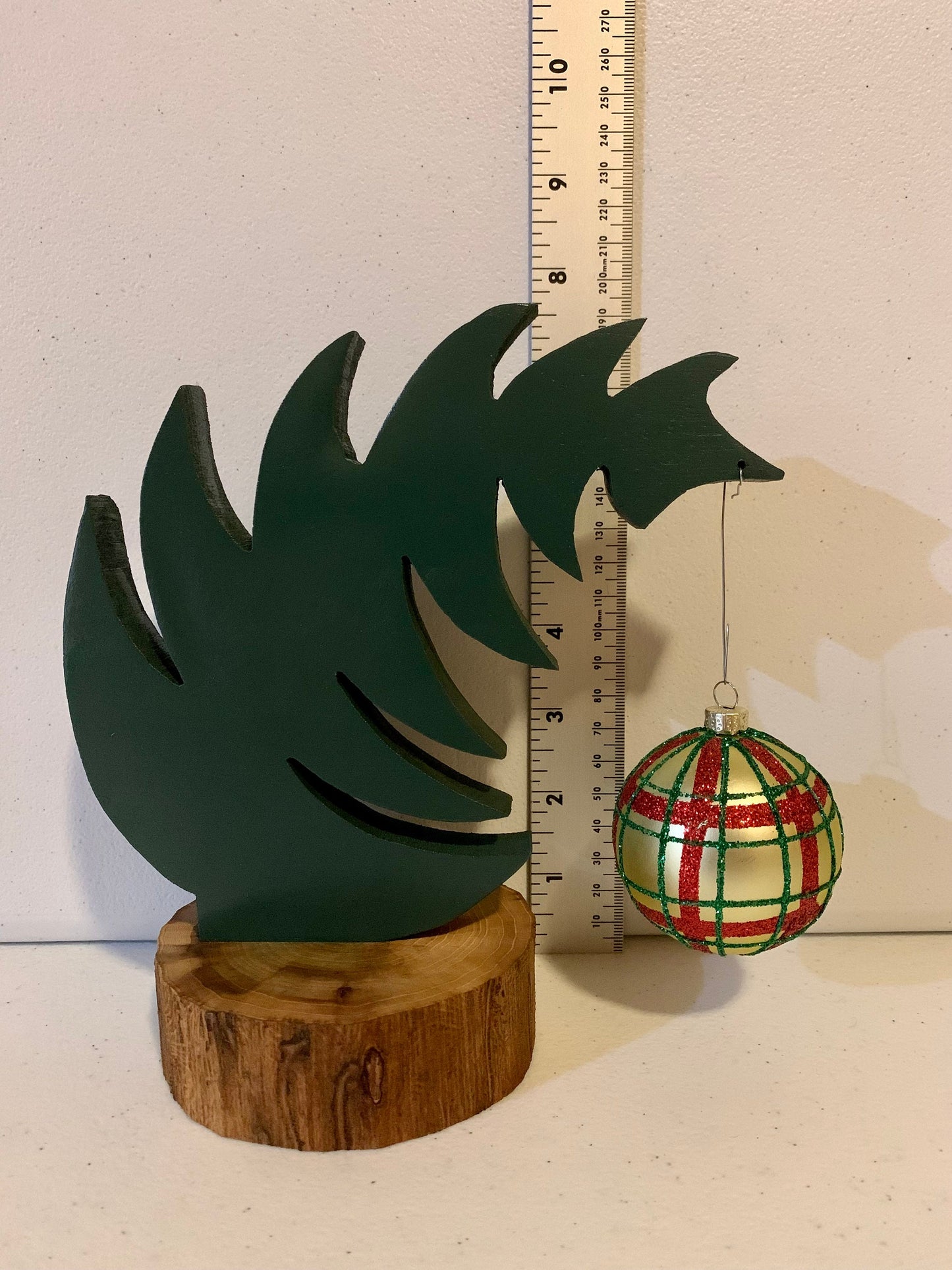 Small Leaning "Grinch Style" Christmas Tree With Natural Tree Trunk Base